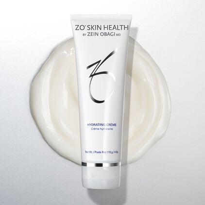 Hydrating Cr&egrave;me against a cream swatch
